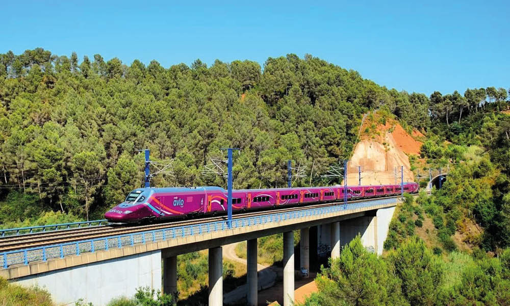 A “no frills” AVLO train crossing. AVLO is the low-cost branch of RENFE