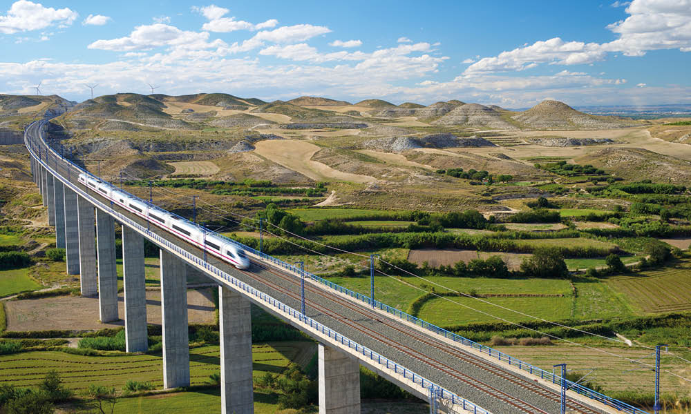 A high-speed train (AVE) crossing a viaduct in Aragón, between Girona and Madrid